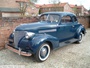 Chevrolet 102 Coupe 3500cc circa 1940 - this variant has the optional dual windshield wipers, wide whitewall tires and custom full wheel covers (c) 2013 Vision Motor Services Ltd
