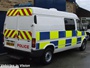 Ford Transit Mk6 combi van (part panel van, part minibus) used as local patrol vehicle with prisoner cage in rear, built 2000-2006 (c) 2013 Vision Motor Services Ltd