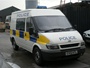 Ford Transit Mk6 combi van (part panel van, part minibus) used as local patrol vehicle with prisoner cage in rear, built 2000-2006 (c) 2013 Vision Motor Services Ltd
