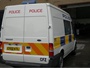 Ford Transit Mk6 combi van (part panel van, part minibus) used as local patrol vehicle with prisoner cage in rear, built 2000-2006 (c) 2013 Vision Motor Services Ltd