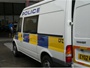 Ford Transit Mk6 combi van (part panel van, part minibus) used as local patrol vehicle with prisoner cage in rear, built 2000-2006 (c) 2013 Vision Motor Services Ltd